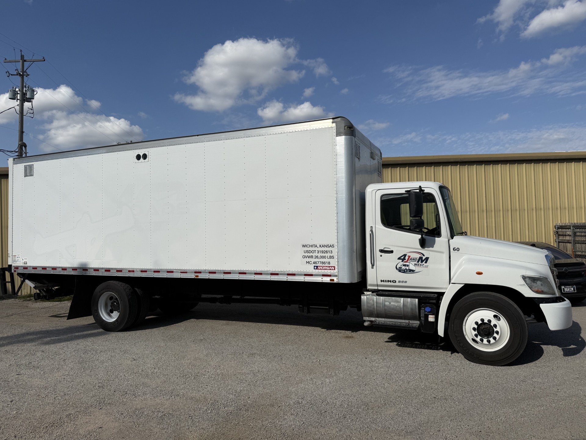 4J and M West box truck, passenger side profile